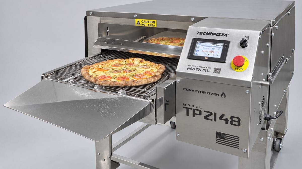 Tecnopizza conveyor pizza oven with a fresh pizza coming out of the conveyor
